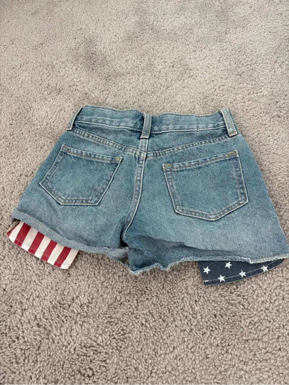 Old Navy high-waisted denim shorts with American flag design